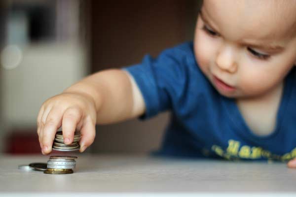 Baby playing with coins
