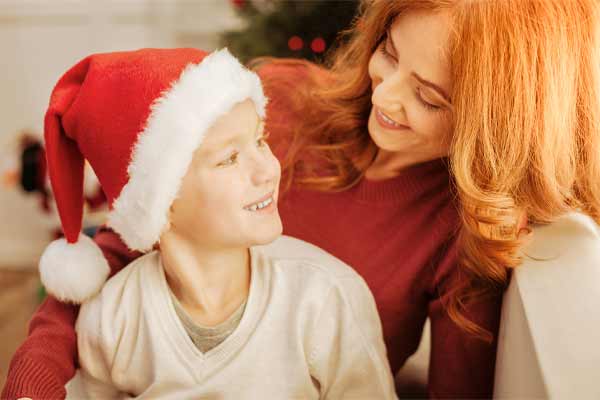 mother and child looking at eachother on christmas, How to Determine Child Holiday Visitation in Chicago
