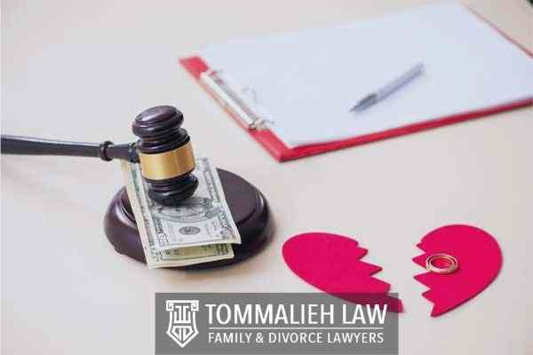 Divorce forms, a gavel, and money on a desk